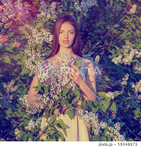 Pretty young woman posing outdoors in nature. Pretty young woman posing outdoors in nature. 59348873
