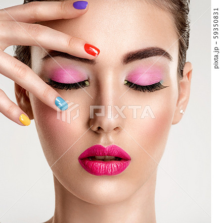 Beautiful fashion woman with a colored nails. Beautiful fashion woman with a colored nails. 59350831