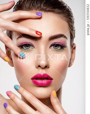 Beautiful fashion woman with a colored nails. Beautiful fashion woman with a colored nails. 59350832