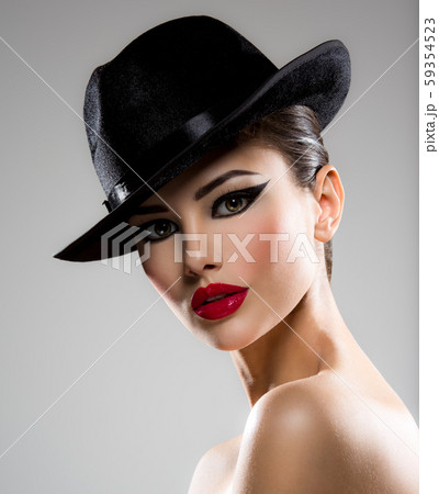 Portrait of a woman in a black hat Portrait of a woman in a black hat 59354523