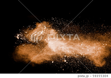 Freeze motion of brown dust explosion.Stopping the movement of brown powder.Explosive brown powder on black background. Freeze motion of brown dust explosion.Stopping the movement of brown powder.Explosive brown powder on black background. 59355304