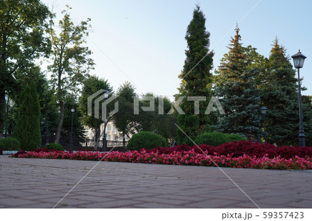 Stone path in the summer park. Green city park. Stone path in the summer park. Green city park. 59357423