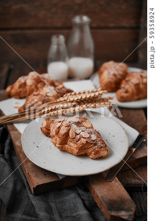 Almond croissant with custard filling on wood 59358924