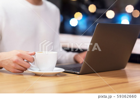 Close Up Of Man With Laptop And Coffee Cup At coffee shop. 59362660