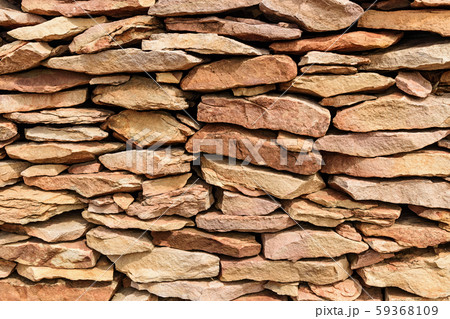 Various size stones stacked in wall Various size stones stacked in wall 59368109