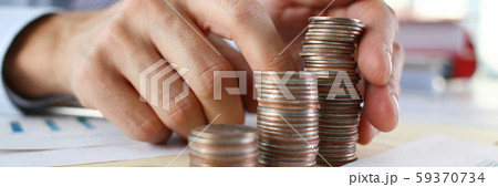 Hand businessman putting pin money Hand businessman putting pin money 59370734