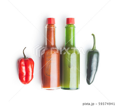 Habanero and jalapeno peppers with tabasco sauce. 59374941