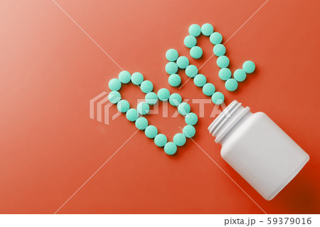 Vitamins B 12 on a red substrate, poured out of a Vitamins B 12 on a red substrate, poured out of a 59379016