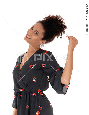 Gorgeous multi-racial woman standing pulling her Gorgeous multi-racial woman standing pulling her 59380342