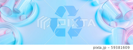 Disposable plastic tableware and recycling sign on a light background in pastel colors. Minimalistic Disposable plastic tableware and recycling sign on a light background in pastel colors. Minimalistic 59381609