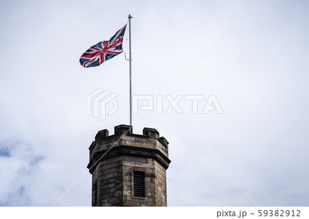British Union Jack at Edinburgh Castle.Edinburgh castle Tower with Union Jack against blue sky British Union Jack at Edinburgh Castle.Edinburgh castle Tower with Union Jack against blue sky 59382912