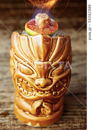 Cocktail in a glass tiki on the bar Cocktail in a glass tiki on the bar 59382986
