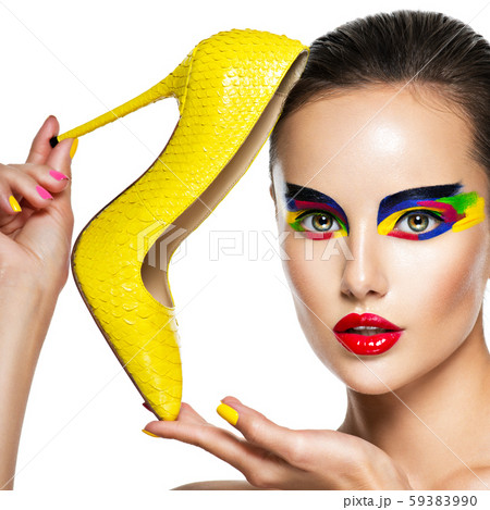 beautiful woman with vivid make-up of eyes holds 59383990