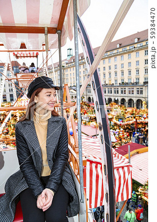 Portrait of beautiful girl riding on ferris wheel Portrait of beautiful girl riding on ferris wheel 59384470