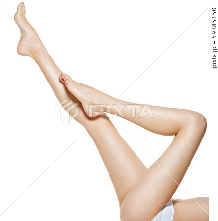 Beautiful female legs isolated on white Beautiful female legs isolated on white 59385150