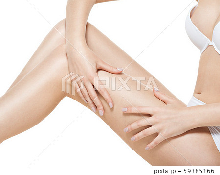 Woman squeezes cellulite skin on  leg 59385166
