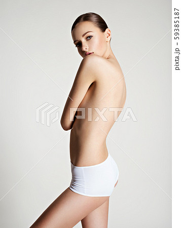 Beautiful woman with perfect body posing at studio Beautiful woman with perfect body posing at studio 59385187