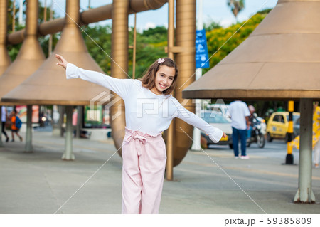 Beautiful young girl at the Jairo Varela Square in the city of Cali in Colombia Beautiful young girl at the Jairo Varela Square in the city of Cali in Colombia 59385809