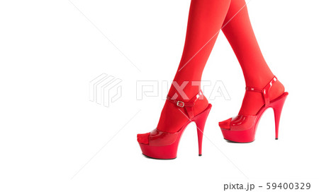 Sexy female feet in fetish red stockings and high heels, isolated on white. Sexy female feet in fetish red stockings and high heels, isolated on white. 59400329