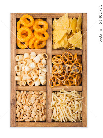 Various snacks in vintage wooden box isolated Various snacks in vintage wooden box isolated 59402751