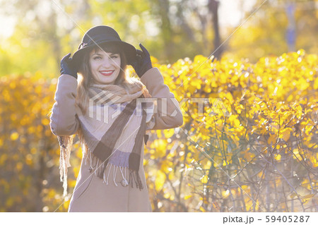 Autumn portrait of beautiful girl in a hat 59405287