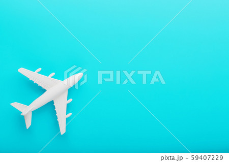 White passenger plane on a blue background. Free space. 59407229
