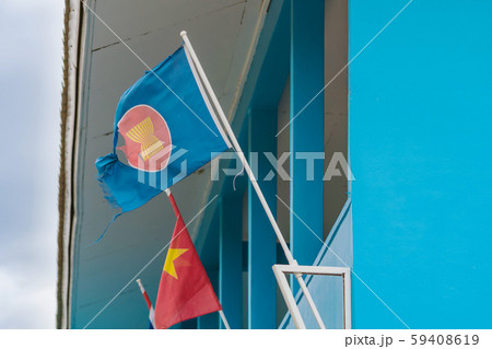 The old Association of South East Asian Nations flag with a big hole decorative on the building 59408619