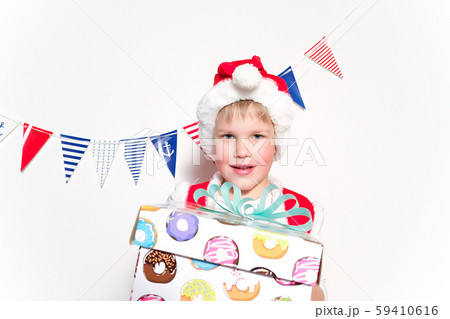 Little Santa helper hold a gift box Little Santa helper hold a gift box 59410616