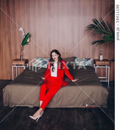 elegant lady in a red suit elegant lady in a red suit 59411196