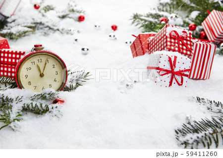 Alarm clock with snow and Christmas decorations Alarm clock with snow and Christmas decorations 59411260