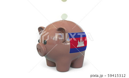 Putting money into piggy bank with flag of Cambodia. Tax system system or savings related conceptual 59415312