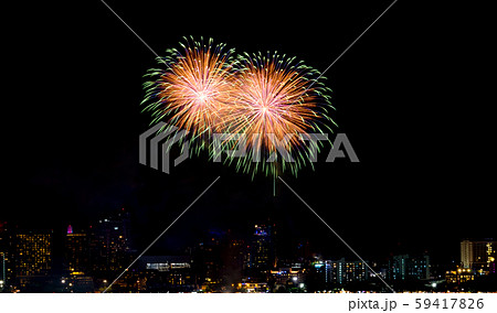 Happy new year fireworks over cityscape at 59417826