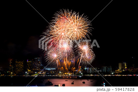 Happy new year fireworks over cityscape at 59417828