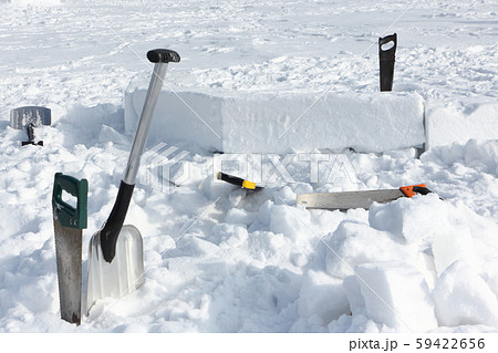 Tools in the snow for building an igloo Tools in the snow for building an igloo 59422656