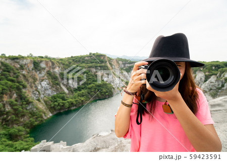 Woman Professional photographer take nature photo Woman Professional photographer take nature photo 59423591