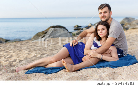 Positive loving couple resting and hugging Positive loving couple resting and hugging 59424583