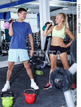 Couple during weightlifting workout 59424681
