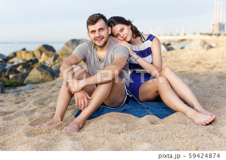 Happy loving couple sitting and hugging 59424874