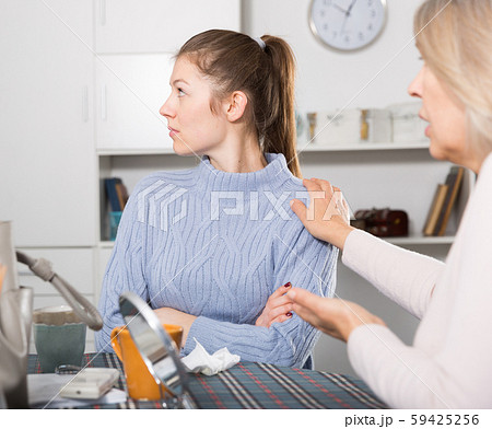 Mature mother and adult daughter quarrelling in domestic interior 59425256