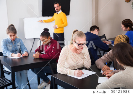 Girls and boys students are working in large groups Girls and boys students are working in large groups 59425988