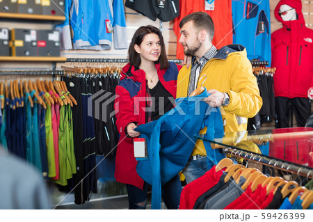 Couple deciding on track jacket 59426399