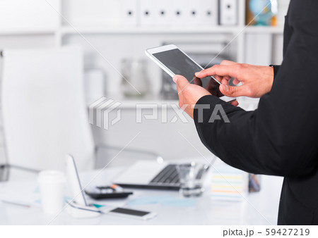 Man using touchscreen phone Man using touchscreen phone 59427219