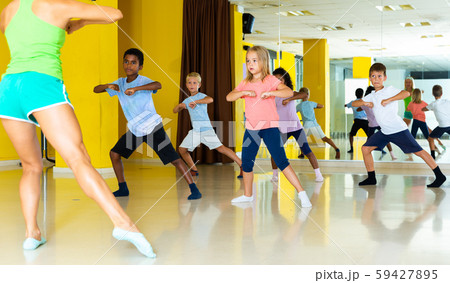 Active young children posing at dance class Active young children posing at dance class 59427895