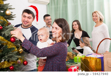 Happy family with Christmas tree at home. Happy family with Christmas tree at home. 59427940