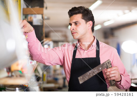 Joiner looking for necessary tools 59428161