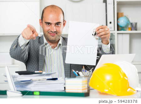 Professional man working with documents Professional man working with documents 59428378