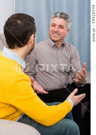 Adult father and son friendly conversation Adult father and son friendly conversation 59428549