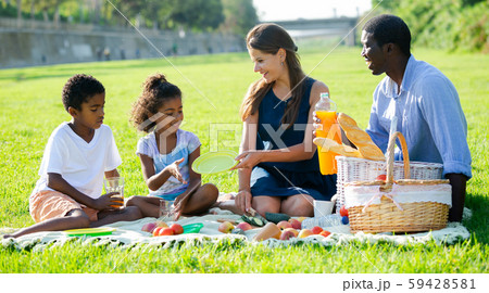 Parents with daughter and son at picnic Parents with daughter and son at picnic 59428581