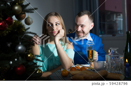 Husband apologizing his offended wife 59428796