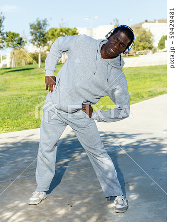 Active african american man doing workout in park at sunny day 59429481